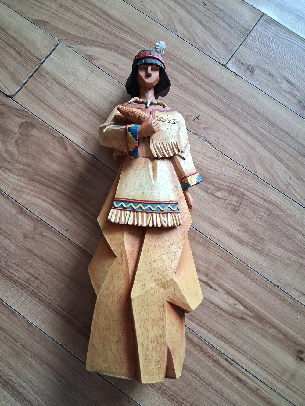 Handcrafted Beige Wooden Figurine with Multicolor Trim
